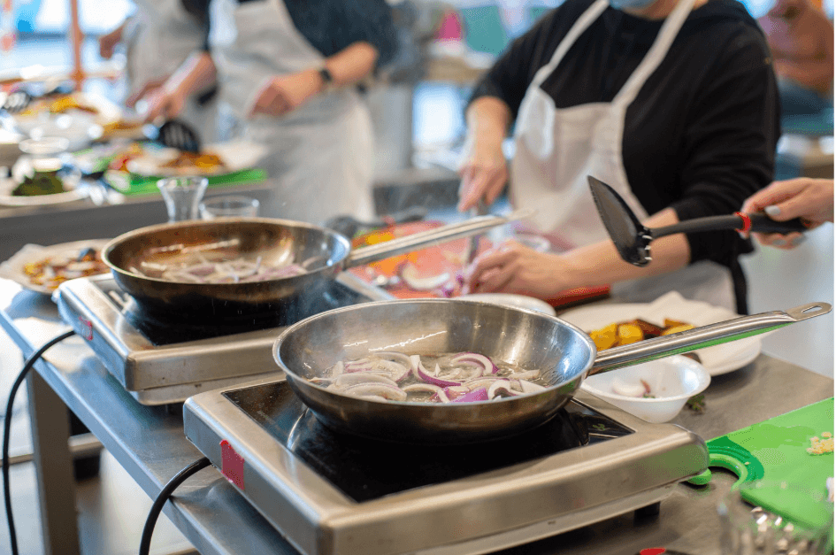People cooking at cooking class